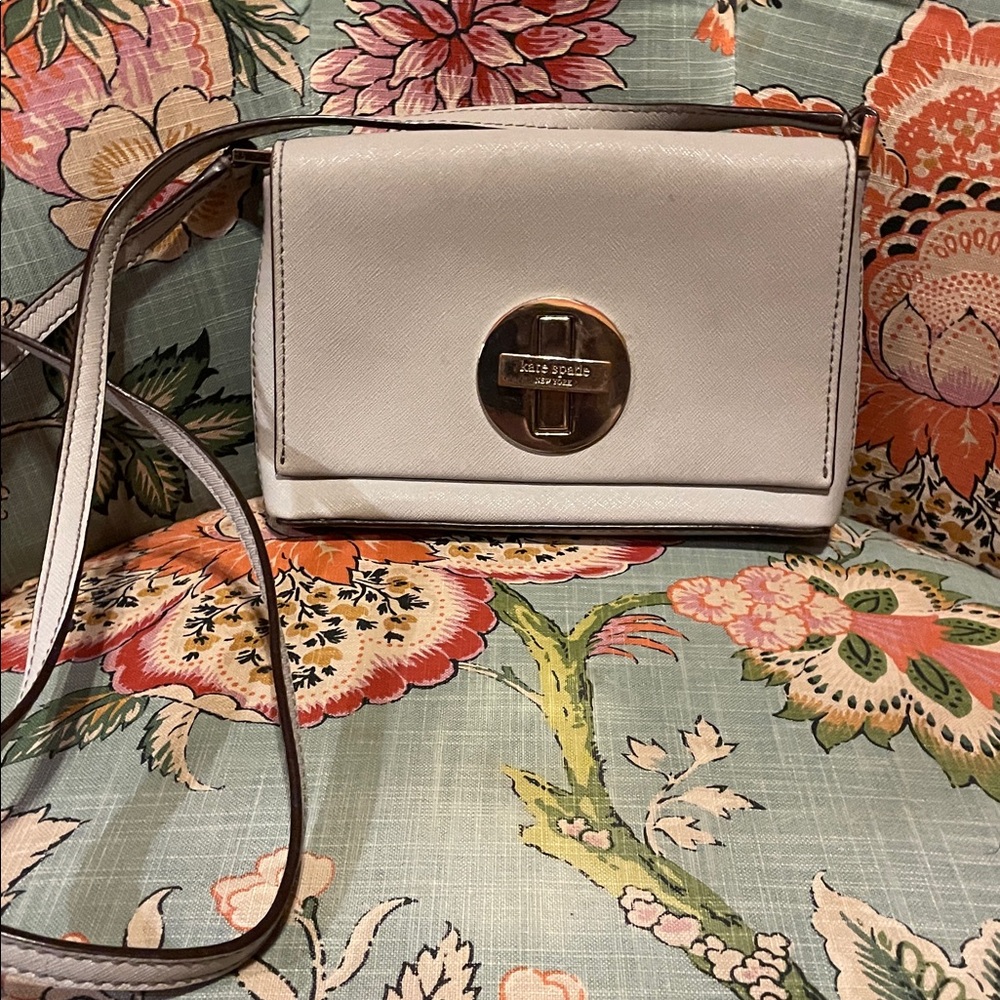 Kate Spade Light GreyCrossbody Bag with Gold Accent.